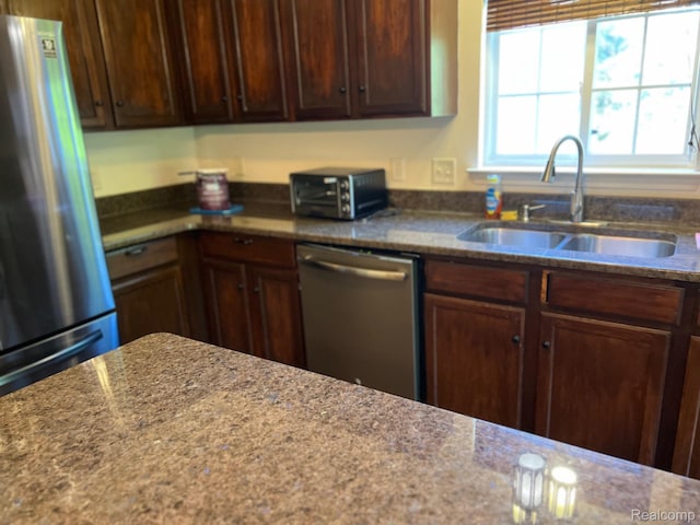 2065 Pinecroft Dr Unit 201, Canton, MI 48188 - kitchen featuring stainless steel appliances, a sink, and dark stone counters