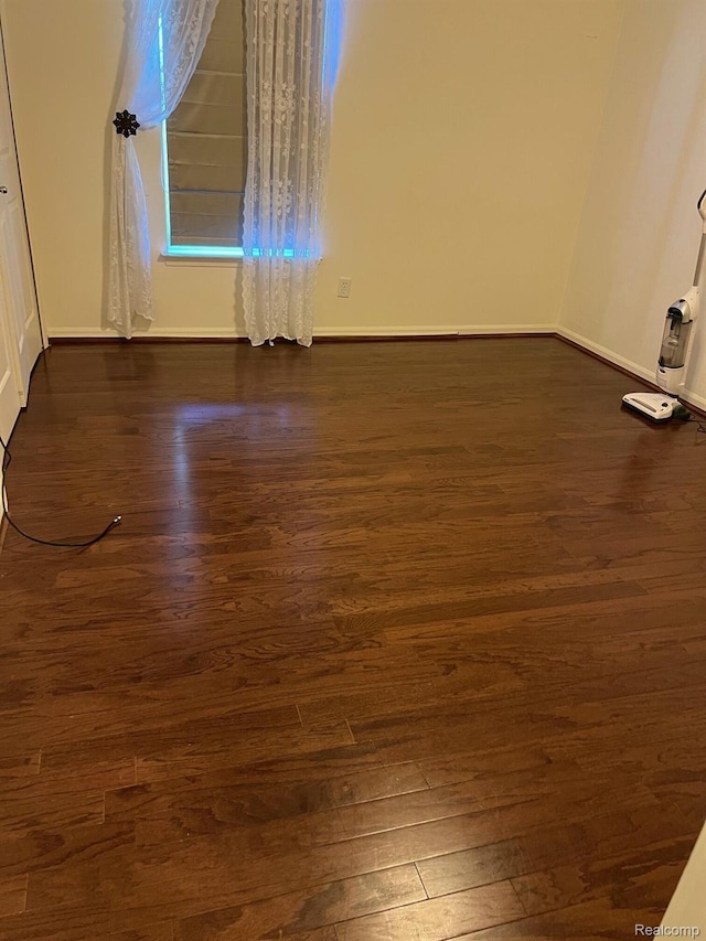 2065 Pinecroft Dr Unit 201, Canton, MI 48188 - spare room with dark wood-type flooring and baseboards