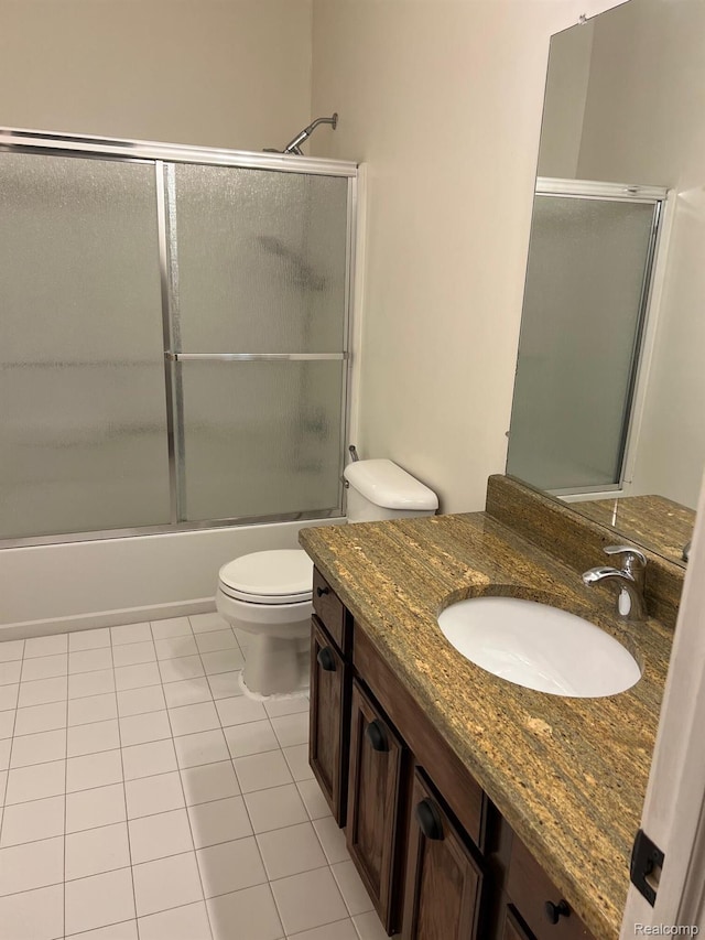 2065 Pinecroft Dr Unit 201, Canton, MI 48188 - bathroom with toilet, vanity, bath / shower combo with glass door, and tile patterned flooring