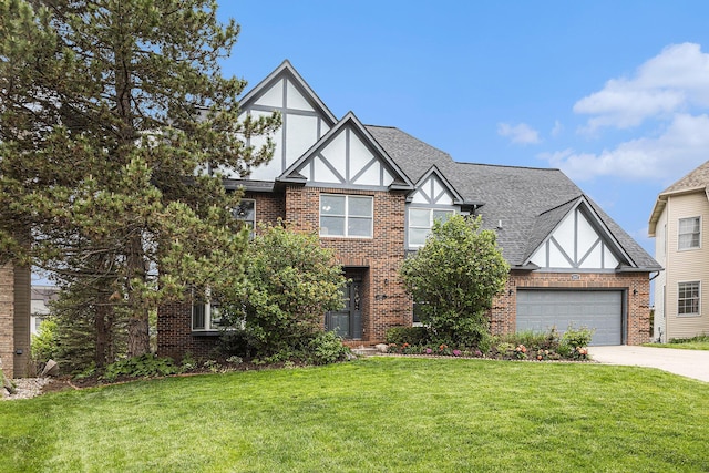 1817 High Pointe Ln, Ann Arbor, MI 48108 - tudor home featuring brick siding, concrete driveway, a front lawn, roof with shingles, and an attached garage