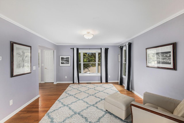 1817 High Pointe Ln, Ann Arbor, MI 48108 - living area featuring crown molding, wood finished floors, and baseboards
