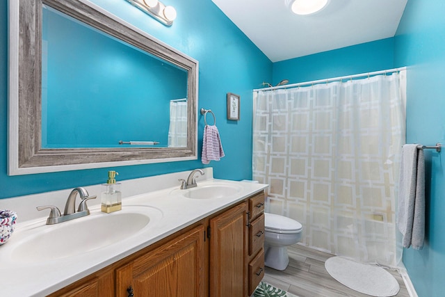 1817 High Pointe Ln, Ann Arbor, MI 48108 - full bath with toilet, a shower with shower curtain, double vanity, and wood finished floors