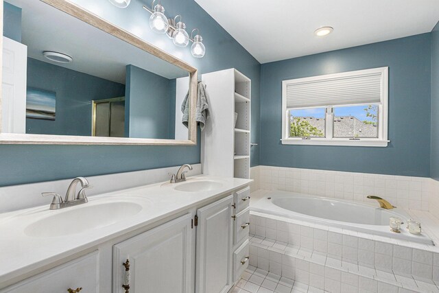 1817 High Pointe Ln, Ann Arbor, MI 48108 - bathroom featuring a garden tub, double vanity, a stall shower, and tile patterned floors