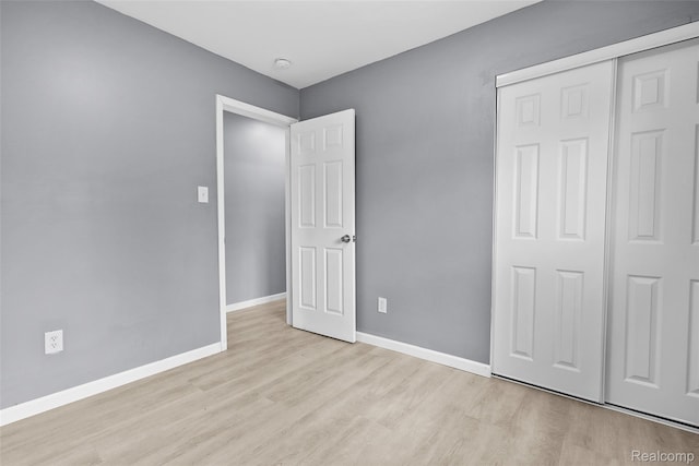 3907 Bayhan St, Inkster, MI 48141 - unfurnished bedroom featuring wood finished floors, a closet, and baseboards