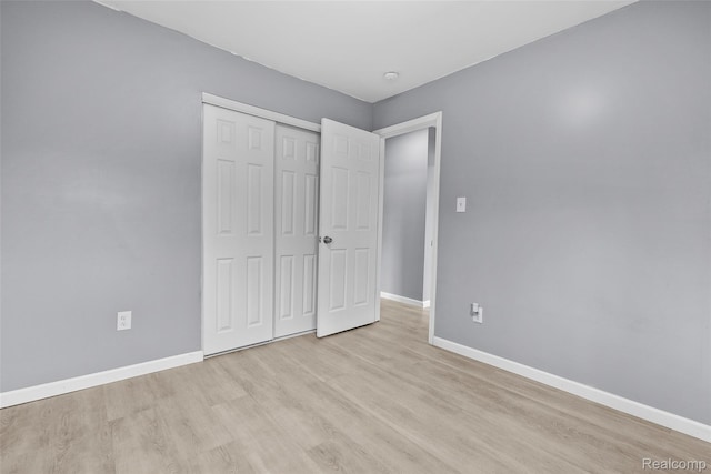 3907 Bayhan St, Inkster, MI 48141 - unfurnished bedroom featuring light wood-type flooring, baseboards, and a closet