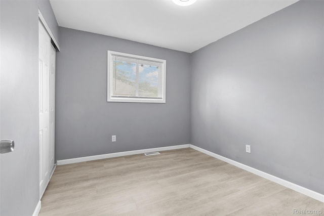3907 Bayhan St, Inkster, MI 48141 - unfurnished bedroom featuring a closet, light wood-style floors, and baseboards