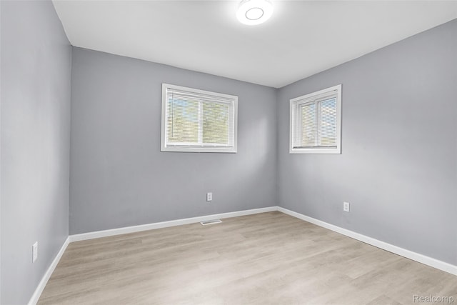 3907 Bayhan St, Inkster, MI 48141 - unfurnished room featuring plenty of natural light, light wood-style floors, and baseboards