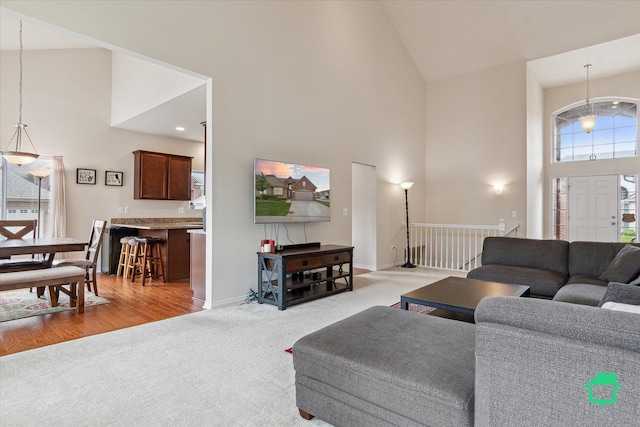 5104 Hawkseye Trce, Warren, MI 48092 - living area featuring high vaulted ceiling, carpet, and baseboards