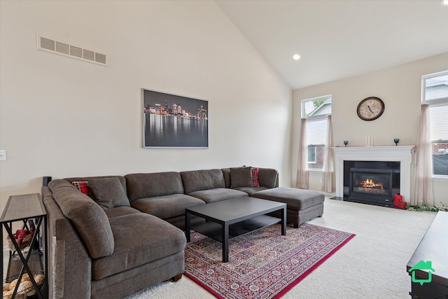 5104 Hawkseye Trce, Warren, MI 48092 - carpeted living room with high vaulted ceiling, a fireplace with flush hearth, and recessed lighting