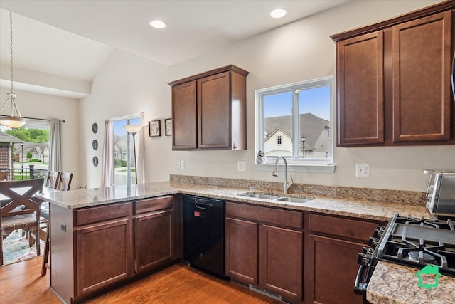 5104 Hawkseye Trce, Warren, MI 48092 - kitchen with black appliances, a sink, a peninsula, light wood-type flooring, and decorative light fixtures