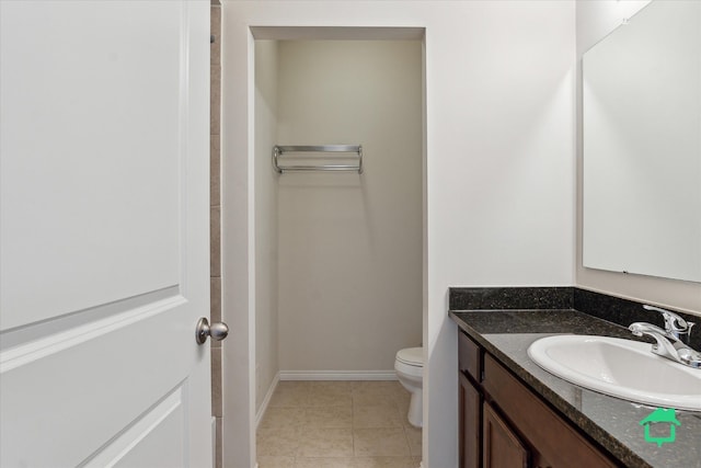 5104 Hawkseye Trce, Warren, MI 48092 - bathroom featuring toilet, vanity, baseboards, and tile patterned floors