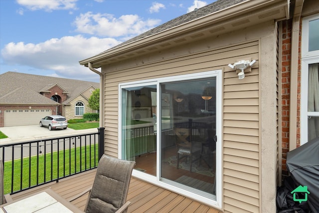 5104 Hawkseye Trce, Warren, MI 48092 - deck featuring a yard, concrete driveway, area for grilling, and a garage