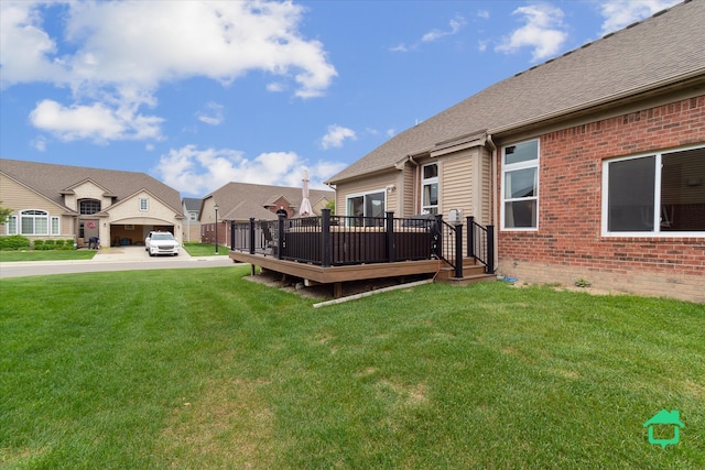 5104 Hawkseye Trce, Warren, MI 48092 - view of green lawn featuring a deck and a residential view