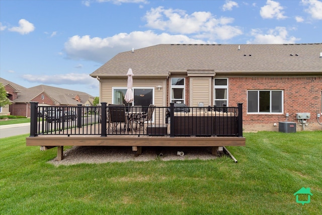 5104 Hawkseye Trce, Warren, MI 48092 - back of property featuring a wooden deck, brick siding, a yard, and central AC