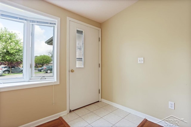 402 Morningside Dr, Midland, MI 48640 - doorway to outside with baseboards and light tile patterned flooring