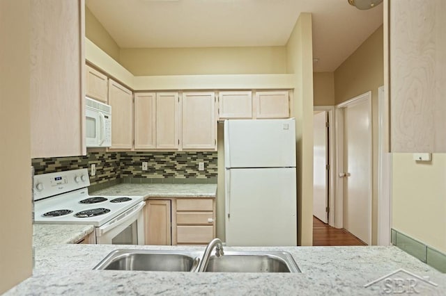 402 Morningside Dr, Midland, MI 48640 - kitchen featuring white appliances, a sink, light brown cabinets, decorative backsplash, and light stone counters
