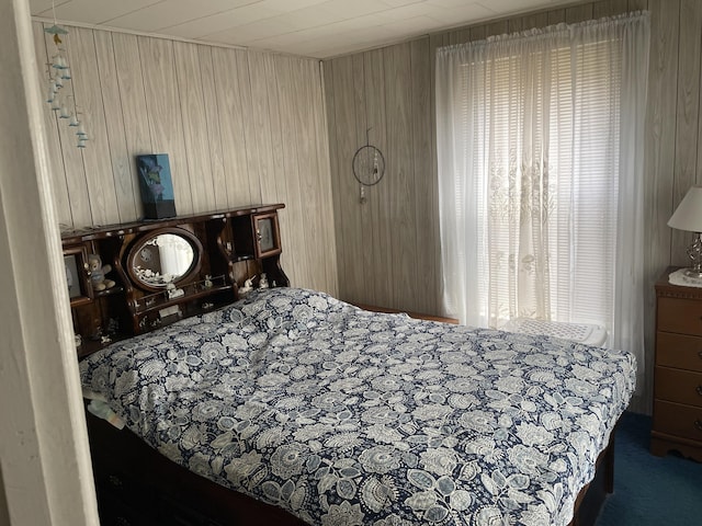 9 N Michigan Ave, Shelby, MI 49455 - bedroom featuring wooden walls and carpet