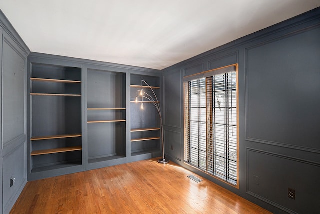 3331 Salem Ct, Rochester Hills, MI 48306 - empty room with a decorative wall and light wood-style floors