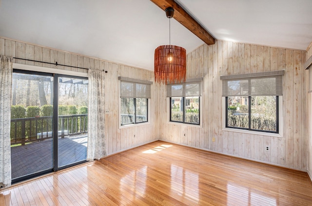 3331 Salem Ct, Rochester Hills, MI 48306 - unfurnished dining area with wood-type flooring, wooden walls, and baseboards
