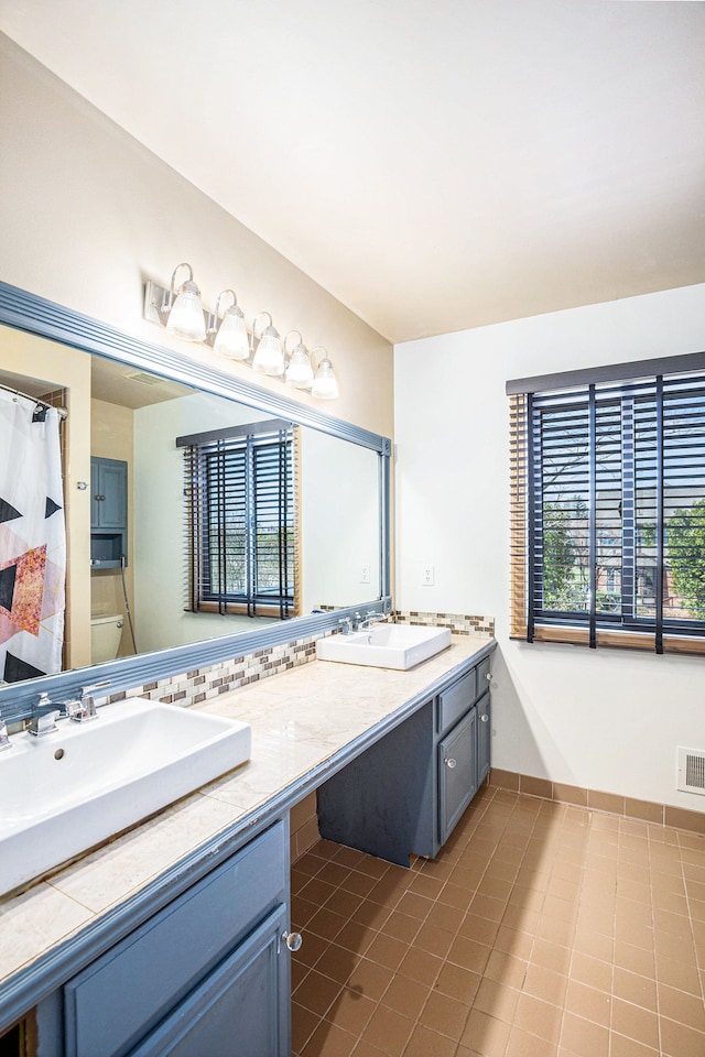 3331 Salem Ct, Rochester Hills, MI 48306 - bathroom featuring double vanity, tile patterned floors, baseboards, toilet, and curtained shower