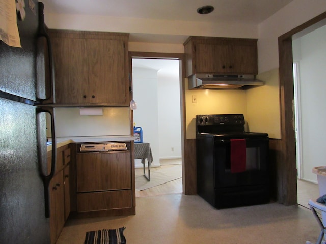 kitchen featuring under cabinet range hood, black appliances, and light countertops