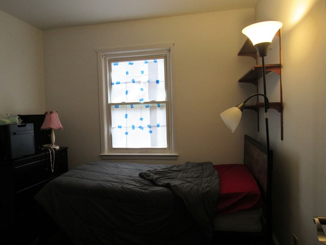 bedroom featuring multiple windows