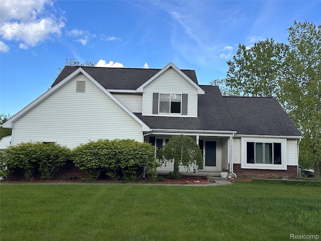 790 Vivian Ln, Oxford, MI 48371 - view of front of house with a front lawn, a shingled roof, and brick siding