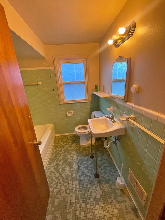 4057 High St, Ecorse, MI 48229 - bathroom with tile walls, wainscoting, a sink, toilet, and tile patterned flooring