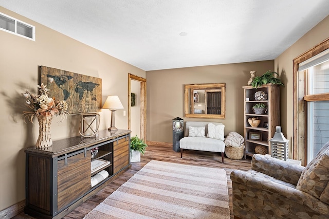 9861 W Doyle Dr, Mecosta, MI 49332 - sitting room with dark wood finished floors