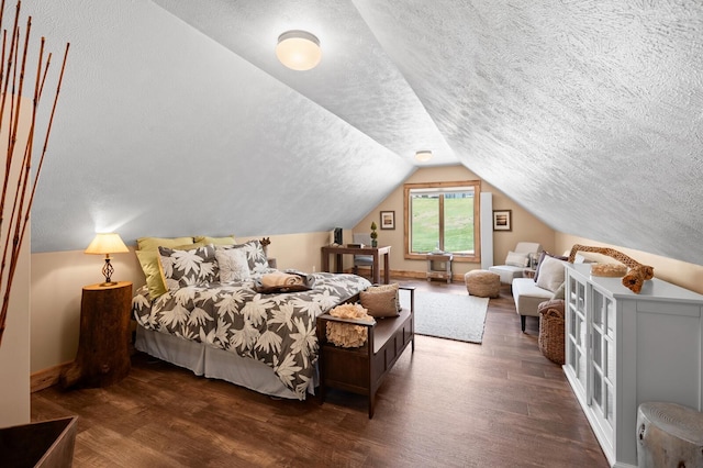 9861 W Doyle Dr, Mecosta, MI 49332 - bedroom with a textured ceiling, lofted ceiling, wood finished floors, and baseboards