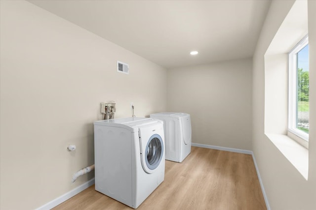 10820 Cedar Lake Rd, Pinckney, MI 48169 - laundry room featuring light wood-style flooring, baseboards, separate washer and dryer, and recessed lighting