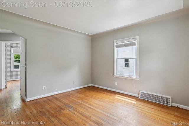 1976 Bacon Ave, Berkley, MI 48072 - empty room with arched walkways and wood-type flooring