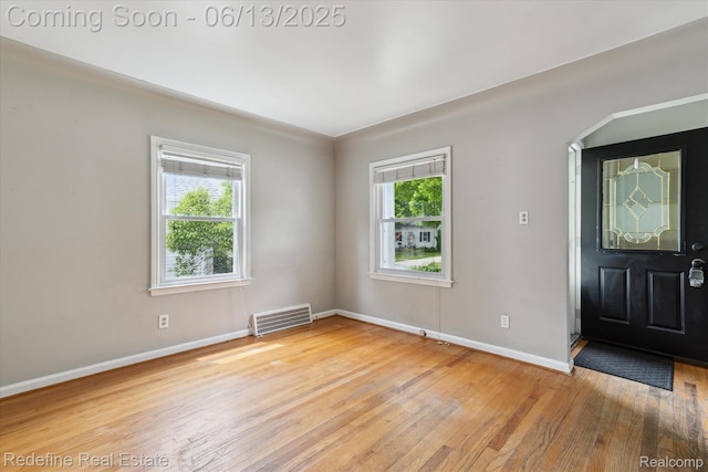 1976 Bacon Ave, Berkley, MI 48072 - foyer entrance featuring light wood-type flooring and arched walkways
