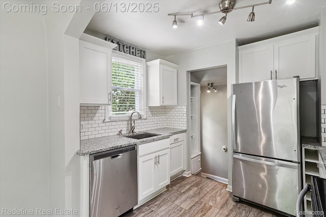 1976 Bacon Ave, Berkley, MI 48072 - kitchen with appliances with stainless steel finishes, decorative backsplash, white cabinets, and light stone countertops