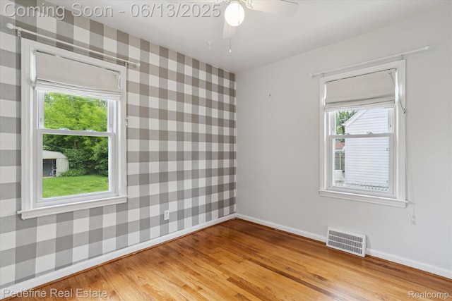 1976 Bacon Ave, Berkley, MI 48072 - empty room with wallpapered walls, light wood finished floors, and a ceiling fan