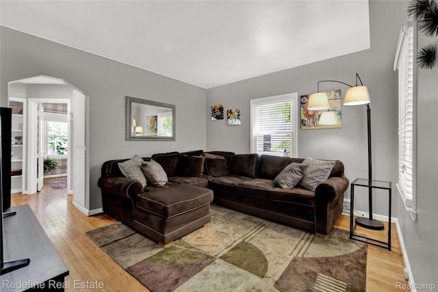 1976 Bacon Ave, Berkley, MI 48072 - living area with arched walkways, wood-type flooring, and plenty of natural light