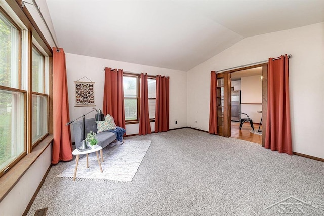 4215 Washington St, Midland, MI 48642 - sitting room with carpet flooring, plenty of natural light, vaulted ceiling, and baseboards