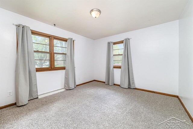 4215 Washington St, Midland, MI 48642 - empty room with carpet flooring and baseboards