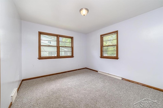 4215 Washington St, Midland, MI 48642 - carpeted spare room with a baseboard radiator, plenty of natural light, and baseboards