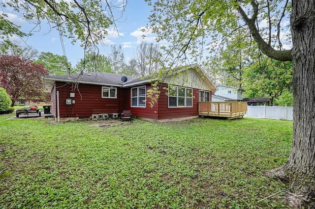 4215 Washington St, Midland, MI 48642 - back of property featuring a deck and crawl space