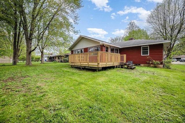 4215 Washington St, Midland, MI 48642 - back of house with a wooden deck and a chimney