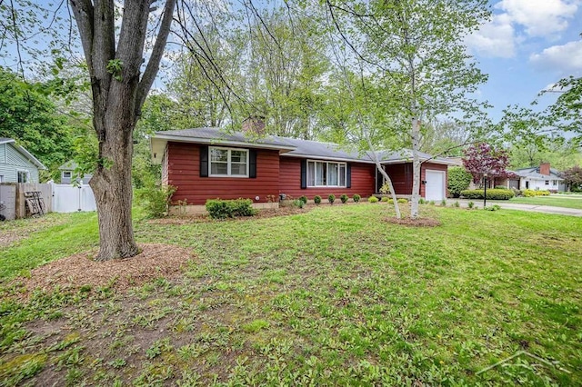 4215 Washington St, Midland, MI 48642 - ranch-style house with an attached garage and concrete driveway