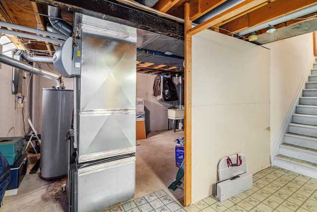 41925 Waterwheel Rd, Northville, MI 48168 - unfinished basement featuring water heater and stairway