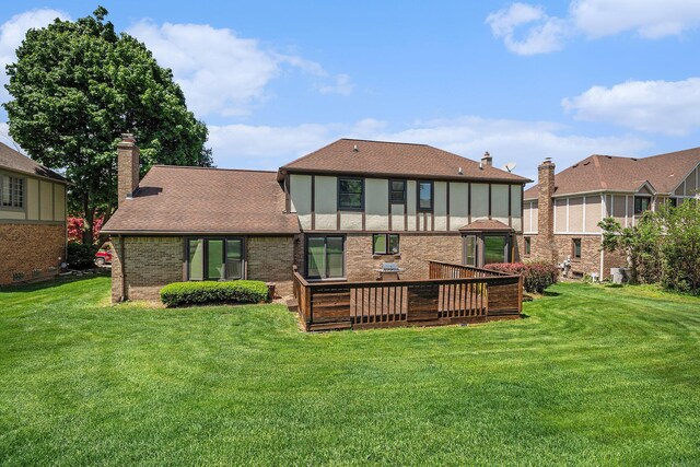 41925 Waterwheel Rd, Northville, MI 48168 - back of house with a chimney, roof with shingles, brick siding, and a lawn