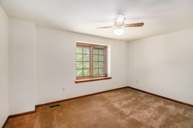 41925 Waterwheel Rd, Northville, MI 48168 - spare room featuring carpet floors and a ceiling fan