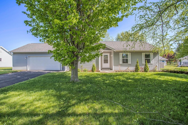 334 Thistle Ave, Climax, MI 49034 - view of front of house featuring asphalt driveway, a front yard, a garage, and a shingled roof