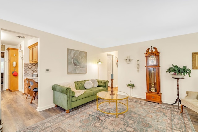 living room featuring light wood-style floors and baseboards