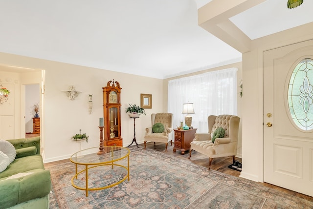 living room featuring wood finished floors and baseboards