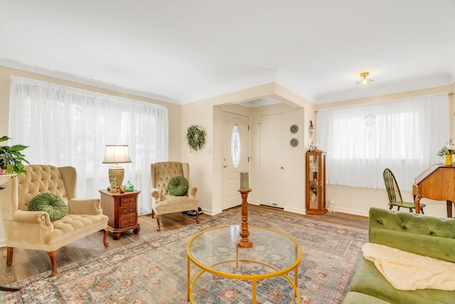 living room with wood finished floors and baseboards