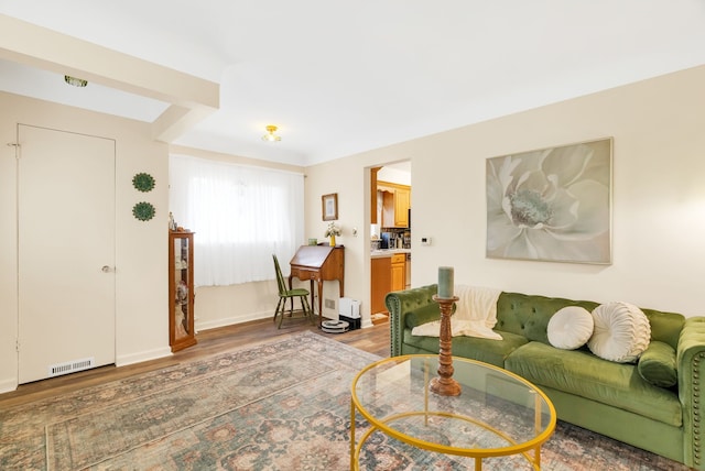 living area featuring wood finished floors and baseboards